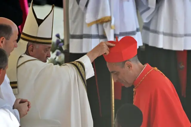 Argentinian prelate Victor Fernandez (right) is elevated cardinal by Pope Francis during a consistory to create 21 new cardinals at St. Peter's square in The Vatican on September 30, 2023