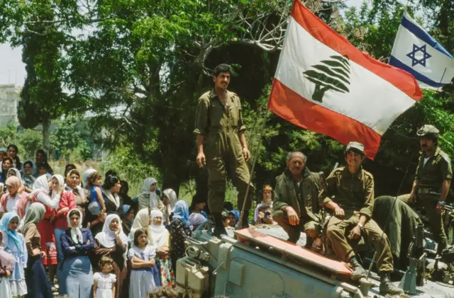 Israeli soldiers in a tank as they enter the Lebanese coastal city of Sidon during an Israeli army attack, in June 1982.