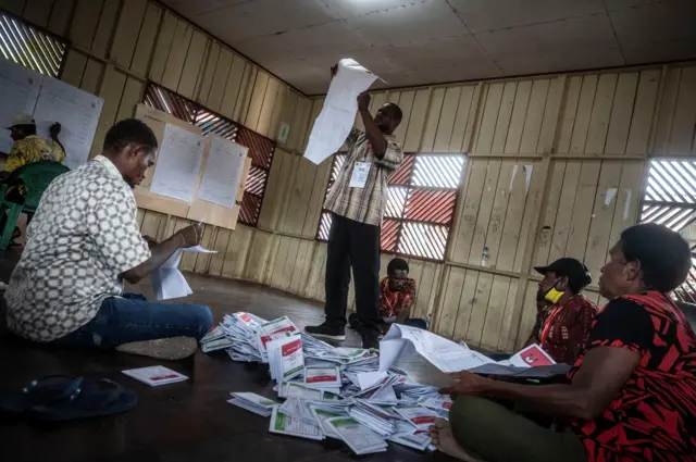 Electoral workers count votes after general election polls closed in Agats District, Asmat Regency, South Papua, Indonesia February 14, 2024. Antara Foto/Aprillio Akbar via REUTERS. 