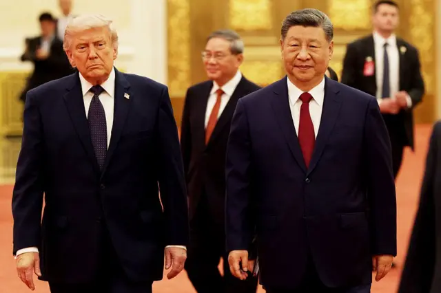 Ông Trump (trái) đến dự tiệc quốc yến do ông Tập Cận Bình chủ trì tại Đại lễ đường Nhân dân vào ngày 14/5/2026 tại Bắc Kinh, Trung Quốc