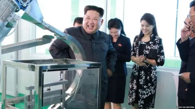 Kim Jong Un holds a hairspray can