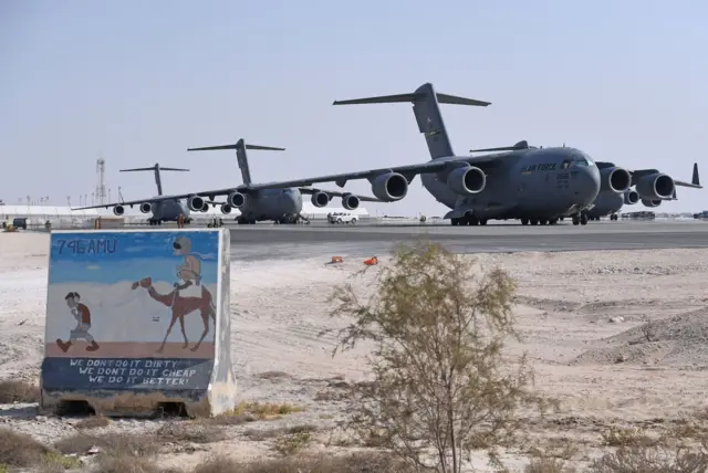 Large aircraft on the runway at Al-Udeid Air Base in Doha, Qatar