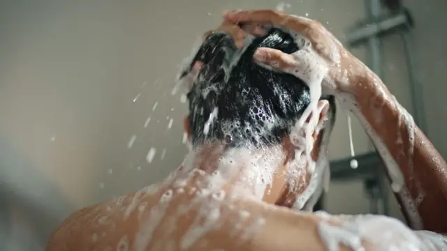 Man washing hair
