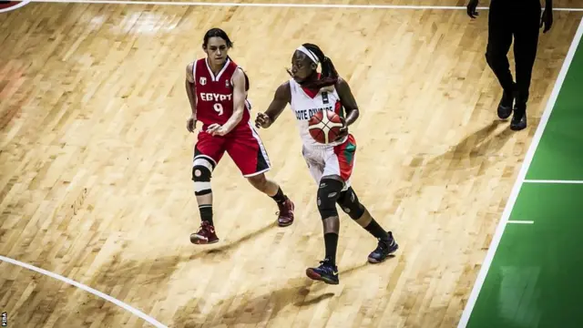 Mariama Kayoute dribbles basketball against Egypt