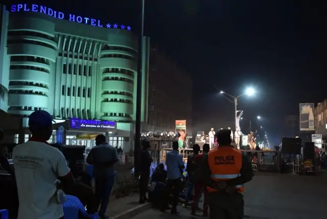 A policeman stands in front of the Splendid hotel, one of the targets of the January 2016 attack claimed by the Al-Qaeda in the Islamic Maghreb