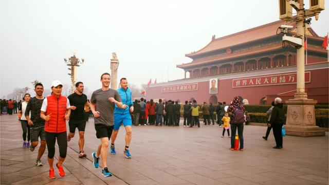 Facebook founder Mark Zuckerberg runs in Beijing's Tiananmen Square