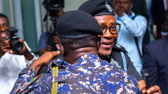 IGP in an embrace wit superintendent George Asare, one of im accusers