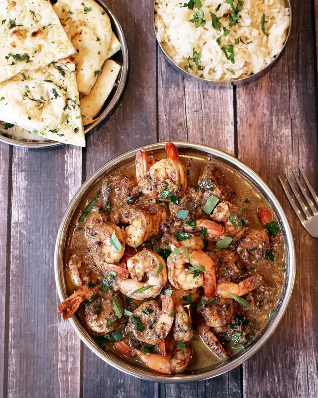 Dark roasting whole spices like cinnamon release flavours completely in this prawn curry