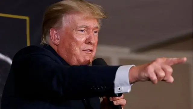 Former US President Donald Trump speaks after the fight between Evander Holyfield and Vitor Belfort