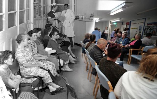 A composite image shows an NHS waiting room at the Montague Hospital, South Yorkshire, in 1959 and a waiting room at Milton Keynes University Hospital in 2018.