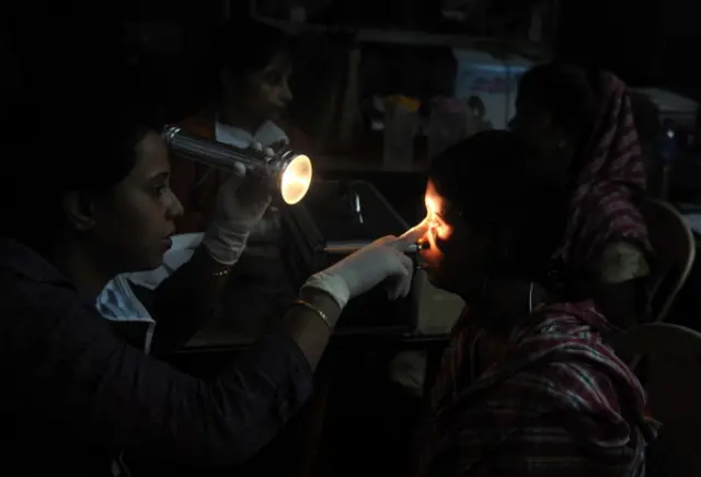 Indian sex workers and their family members attend a health check up in the Khalpara Red light area in Siliguri on July 1,2012. Hundreds of sex workers along with their family members attended the free clinic set up to celebrate national Doctors day and also bring awareness to HIV-AIDS. AFP PHOTO/ Diptendu DUTTA (Photo credit should read DIPTENDU DUTTA/AFP/GettyImages)