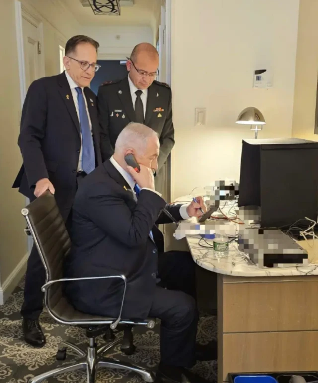 Prime Minister Benjamin Netanyahu making telephone call