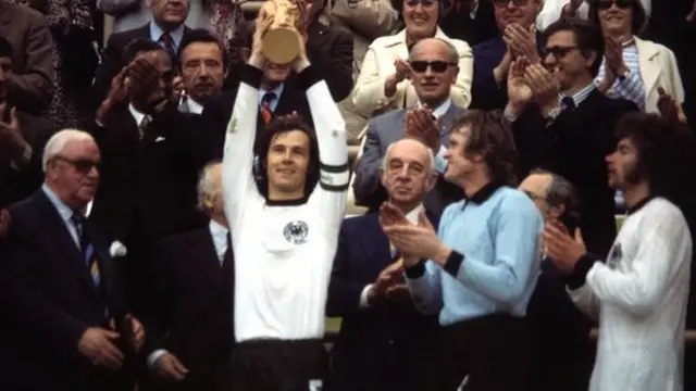 Franz Beckenbauer lifts the 1974 World Cup trophy