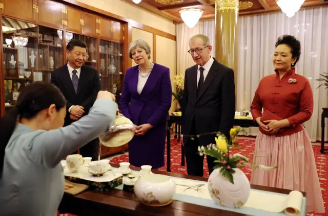 British Prime Minister Theresa May and her husband Philip take part in a Tea Ceremony with Chinese President Xi Jinping and his wife Peng Liyuan at Mr Jinping"s official Diaoyutai State Guesthouse on February 1, 2018 in Beijing, China. Theresa May, who is on a three day visit to China met Chinese President Xi Jinping to discuss matters including the environment, investment, education, Hong Kong and North Korea. (Photo by Dan Kitwood - Pool/Getty Images)