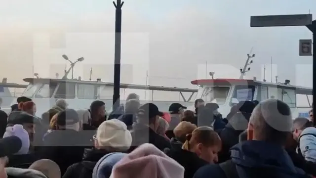 Des habitants de Kherson évacués.