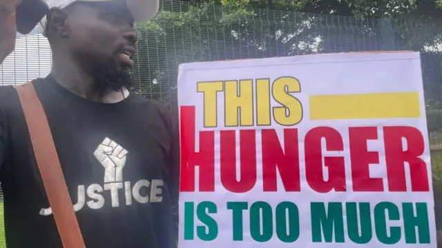 Protester carry placard