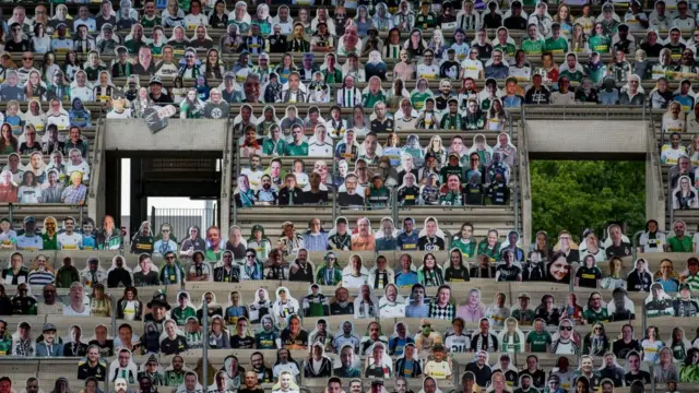 Cardboard of face inside stadium