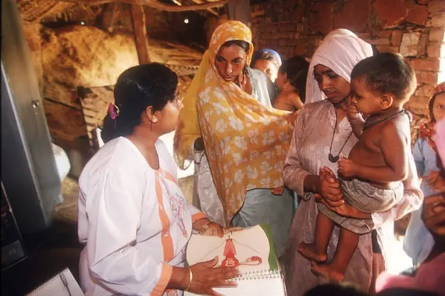 A doctor gives a speech on family planning in the village of Udaka