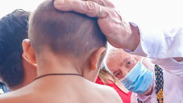Brazil President Lula speaks to an Yanomami child during a visit to Roraima on 21 January