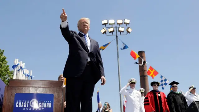U.S. President Donald Trump points to the audience at the conclusion of the United States Coast Guard Academy Commencement Ceremony in New London, Connecticut U.S., May 17, 2017