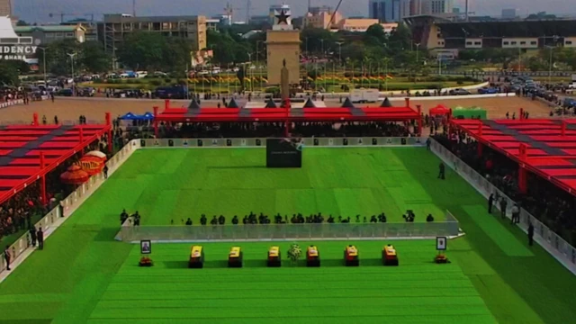 Caskets of the victims lay in the centre of the independence square, to di sides are mourners 