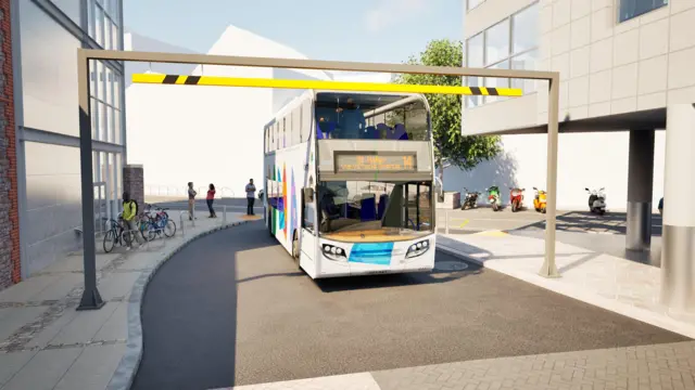 Impresión artística de un autobús blanco de dos pisos, número 14 de Jersey, aproximándose a una barrera de restricción de altura rectangular, gris y amarilla. El lateral actual de la Estación Liberation es visible a la derecha de la imagen.