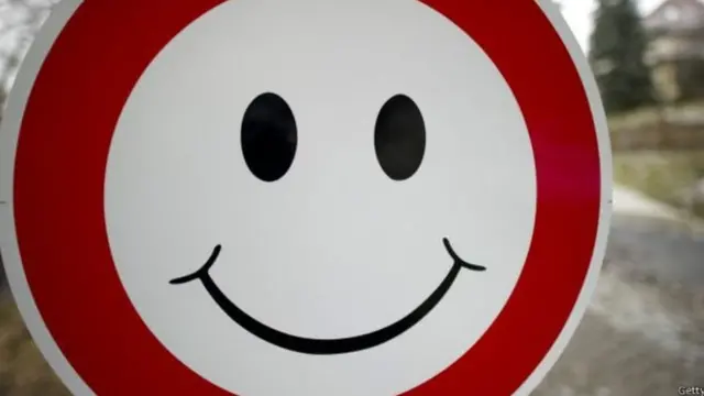 Күлүп турган белги