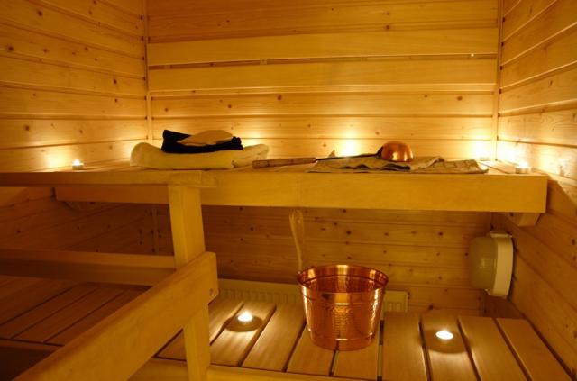 Interior of a Finnish sauna in candle light.