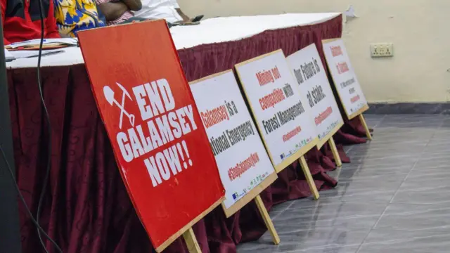 placards by the coalition against illegal mining