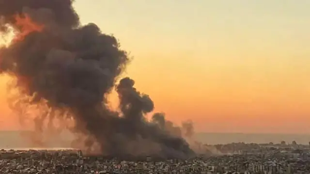 Smoke rises above Beirut's southern suburbs during an Israeli strike.