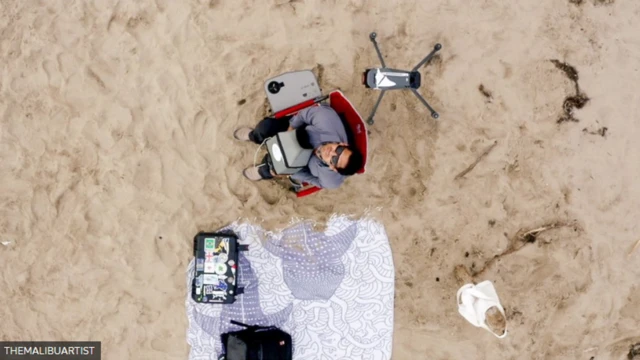 Birdseye view of Carlos using his drone