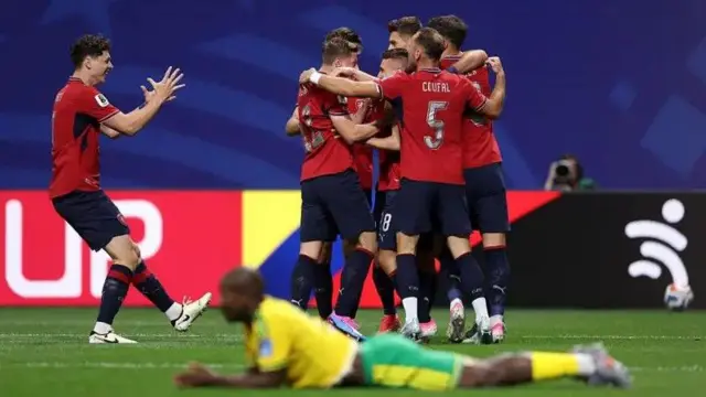 Czech Republic celebrate dia goal as South Africa player lie down for ground