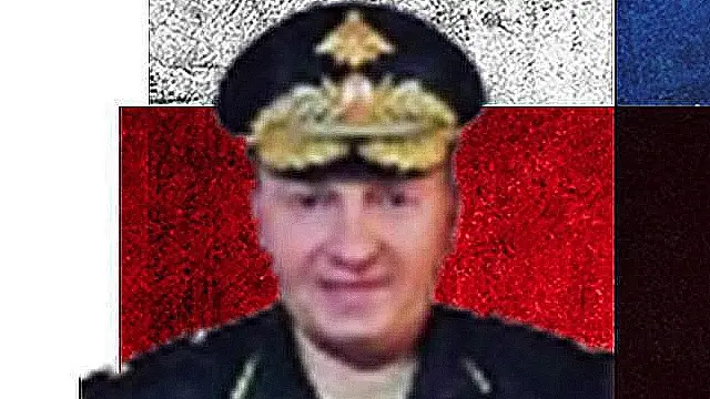 An image of Maj Gen Vladimir Frolov over a treatment of the Russian flag