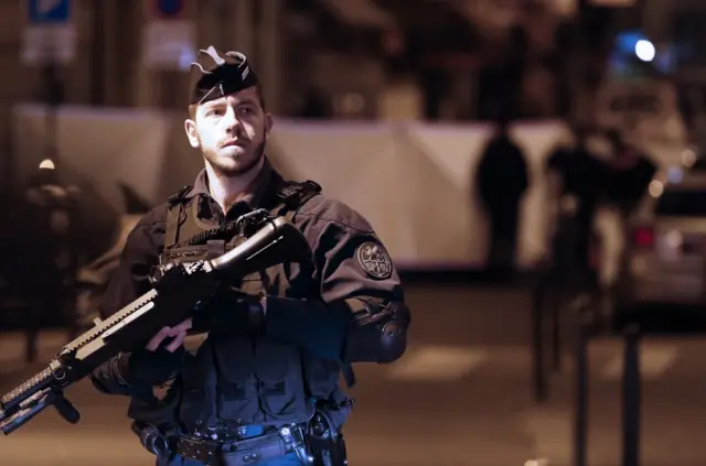 French police stand guard next to the place where a man attacked and stabbed several people in Paris, France, 12 May 2018. According to the latest reports, two persons are dead including the attacker, several were injured. EPA/ETIENNE LAURENT