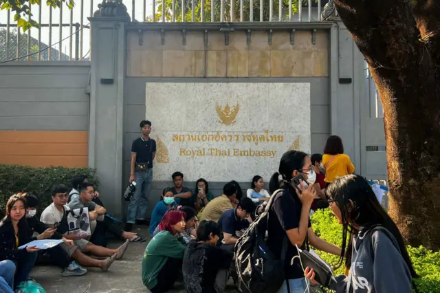 People gather outside the embassy of Thailand 