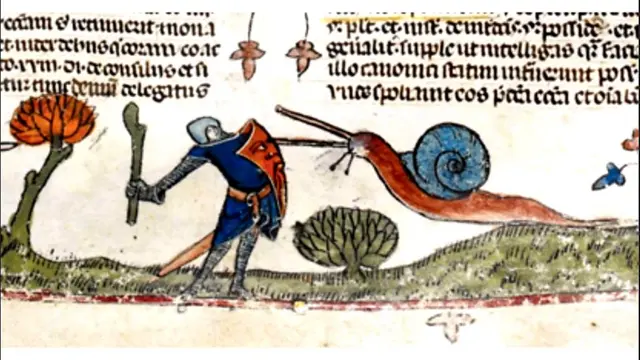 Un caracol atacando a un caballero