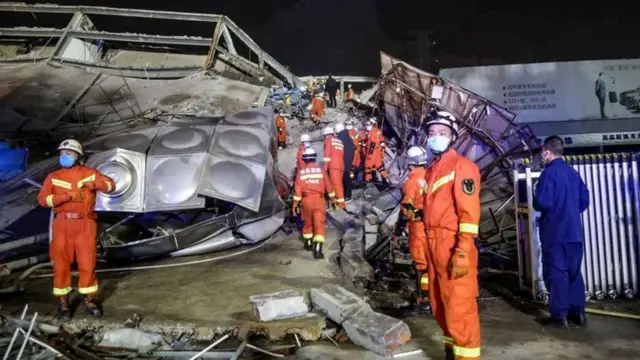 Rescuers work in the rubble of a collapsed hotel in Quanzhou, in China"s eastern Fujian province on March 7, 2020