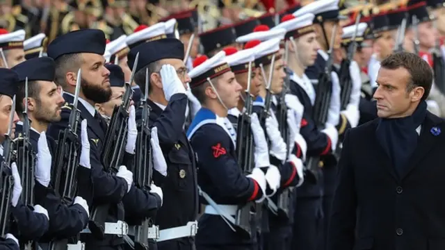 French President Emmanuel Macron reviews troops