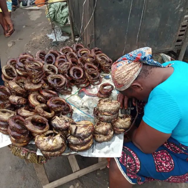 A woman selling fish takes a nap in Agege, Lagos, Nigeria, June 10, 2019. Street trading, despite the fact that is against the law, is a means of survival in Lagos. Photo by Adekunle Ajayi (Photo by Adekunle Ajayi/NurPhoto via Getty Images)