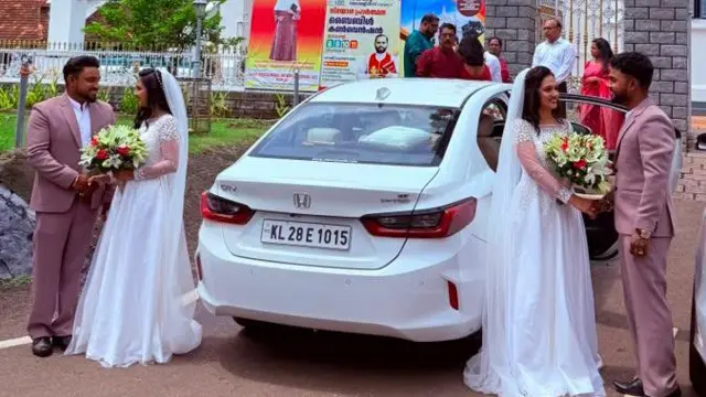 Two brides and grooms arriving at a church in two white cars 
