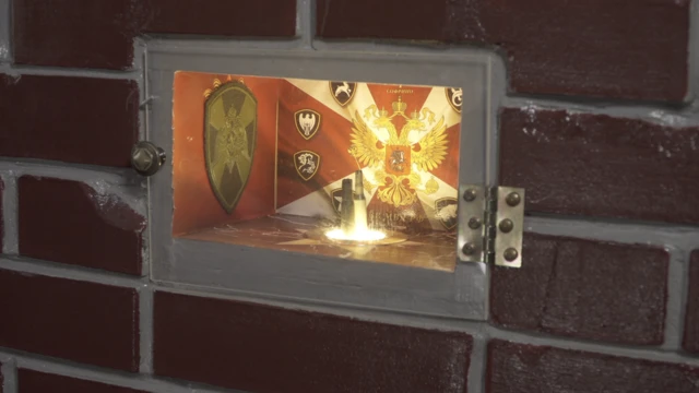 плакат "Внутренние войска МВД РФ" внутри декоративной печки, которую Павел сложил в своей комнате сам