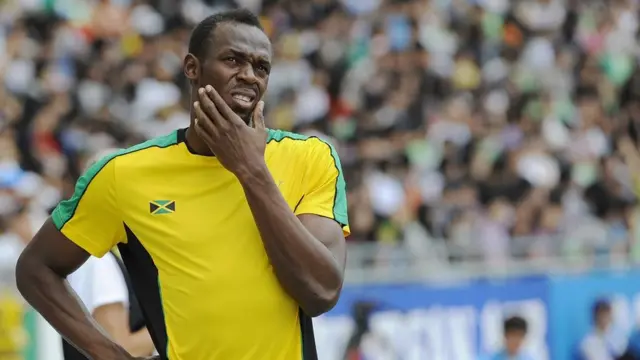 Jamaica's Usain Bolt looks slightly puzzled as he prepares to compete in the men's 200 metres heats at the International Association of Athletics Federations (IAAF) World Championships in Daegu on September 2, 2011