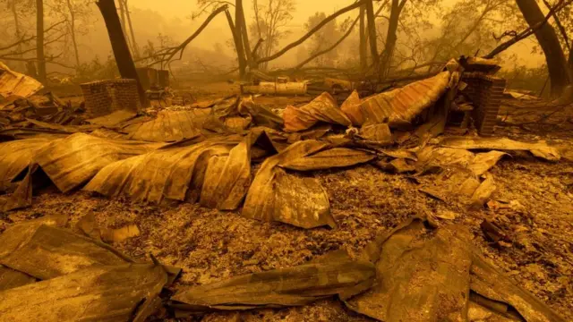 Properties lie in ruins in the Klamath National Forest, California on 31 July