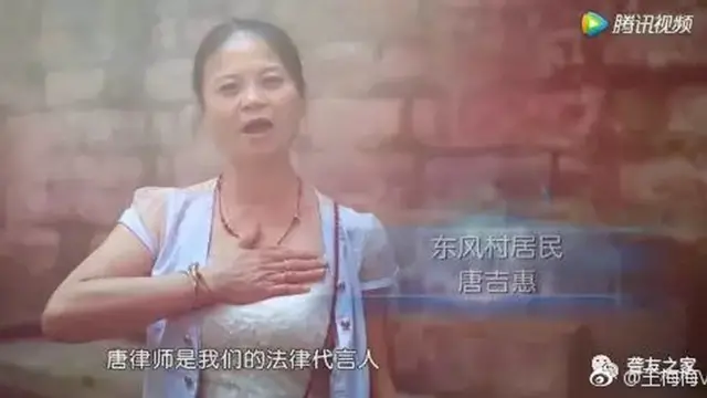 A deaf woman signs her gratefulness for Tang Shuai