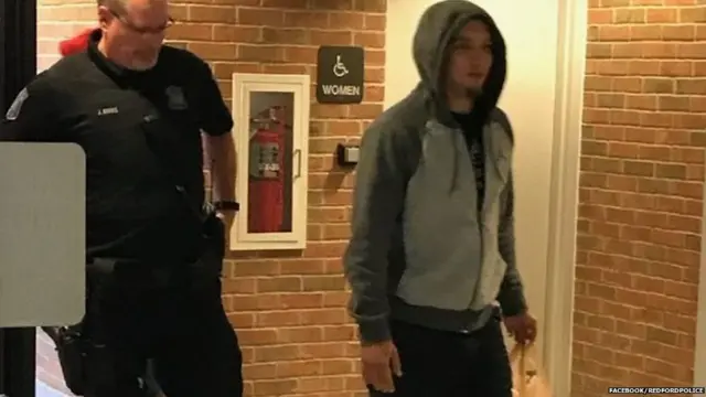 Michael Zaydel walking into the police station