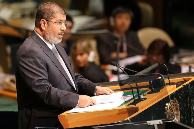 NEW YORK, NY - SEPTEMBER 26: Egyptian President Mohammed Morsi addresses world leaders at the United Nations General Assembly on September 26, 2012 in New York City. Over 120 prime ministers, presidents and monarchs are gathering this week at the U.N. for the annual meeting. This year's focus among leaders will be the ongoing fighting in Syria, which is beginning to threaten regional stability. (Photo by Spencer Platt/Getty Images)