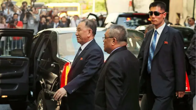 Kim Yong-chol, left, arriving at his New York hotel ahead of meeting Mike Pompeo