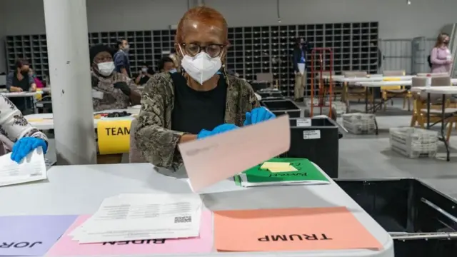 An election worker in Georgia processes ballots during the state's 2020 recount