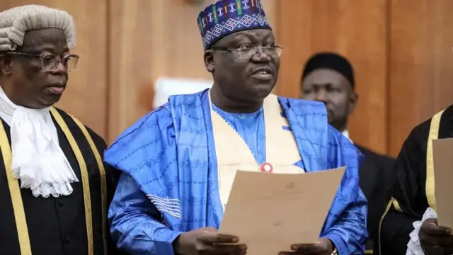 Senate President Ahmed Lawan (C) is being sworn in as Senate President during the inauguration of the Nigerian 9th National Assembly in Abuja. (Photo by Kola SULAIMON / AFP) (Photo credit should read KOLA SULAIMON/AFP/Getty Images)