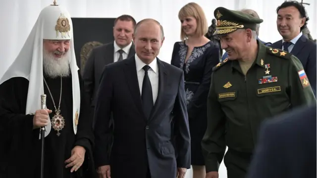 Russian President Vladimir Putin, Defence Minister Sergei Shoigu and Patriarch Kirill